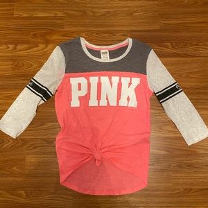 Three quarter sleeve shirt.